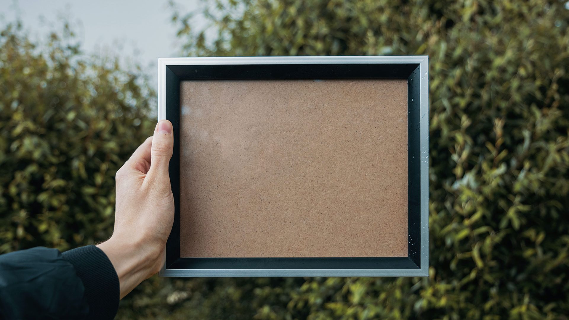 blank frame - person holding a photo frame - white frame with no photo