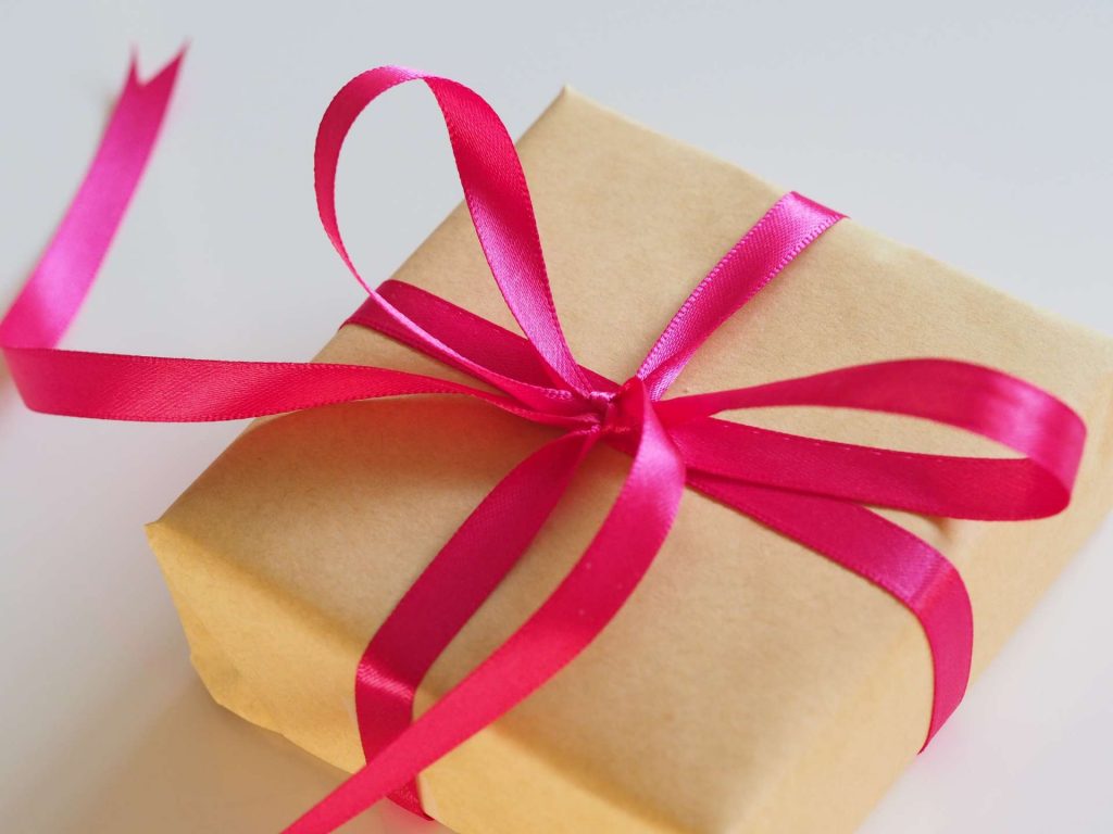 brown gift with red ribbon