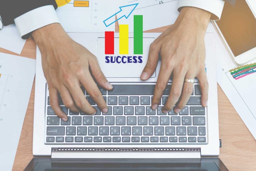 success - analyzing seo competitors - laptop keyboard - hands typing