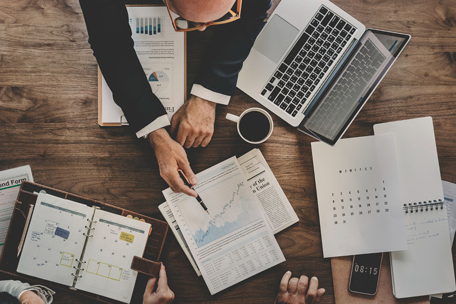 People planning a business strategy at the desk.